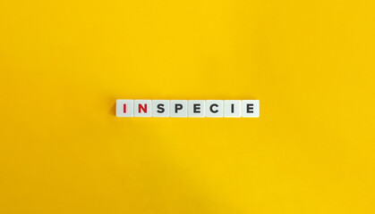 In Specie Phrase on Letter Tiles on Yellow Background. Minimal Aesthetics.