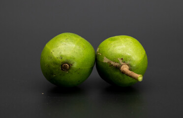 selective focus, two hog plum fruits isolate on white background.