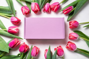 Carton, cardboard box decorated with spring fresh tulip