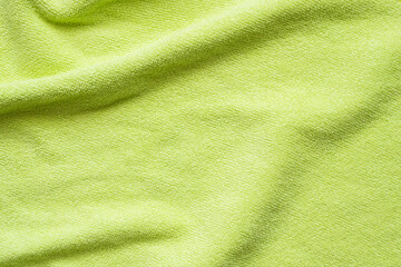 Green towel fabric texture surface close up background