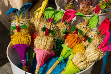 Happy Easter - traditional Easter straw bunnies at the Easter market in Poland. Ethnic Easter bouquets of colorful straw rabbits
