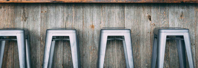 Bar stools near a wooden table