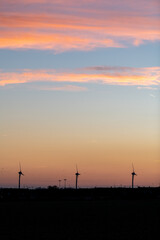 Wind turbines at sunset in France