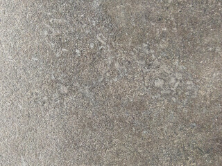 Grey concrete surface with spots. Grey cement background with texture. Old concrete floor.
