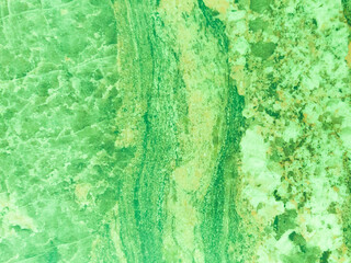 Beautiful, green texture with vertical patterns. Background with marble and stone texture.
