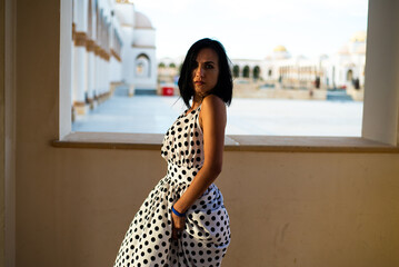 Close-up portrait of magnificent caucasian girl. Woman enjoying life and having fun at resort.
