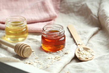 honey in jars is on the table. there is a place to record.