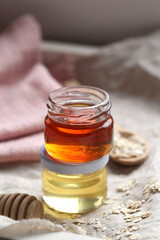 honey in jars is on the table. there is a place to record.