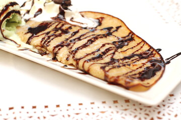Home made pancake, crepe with chocolate and ice cream