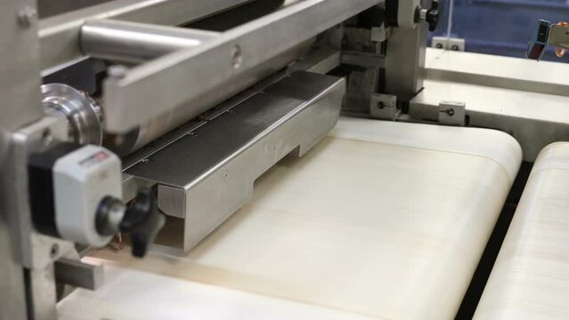 conveyor in the confectionery shop for the production and assembly of chocolate wafers