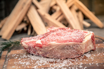 Closeup of a beautiful italian steak ready to be cooked on a barbeque. Appetizing piece of meat...