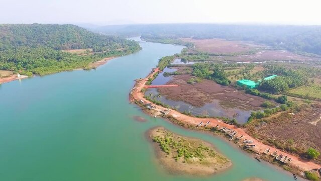 A drone flying over Aravali river in Goa, India.
