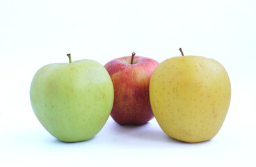 Red, yellow and green apples on a white background. 