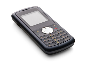 Old push-button mobile phone isolated on a white background