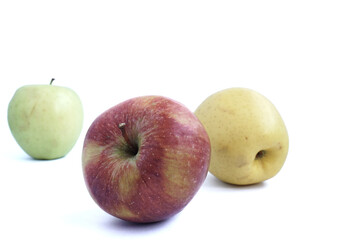 Red, yellow and green apples on a white background. 