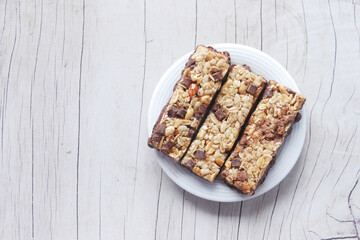 Almond and oat protein bars on table .