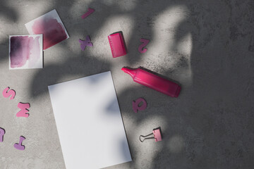 Flat lay of paper sheet mock up and stationery in bright pink color.