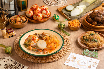 Lontong sayur or vegetable rice cake is an Indonesian traditional rice dish made of pieces of lontong served in coconut milk soup with shredded chayote, tempeh, tofu, hard-boiled egg, sambal, rendang