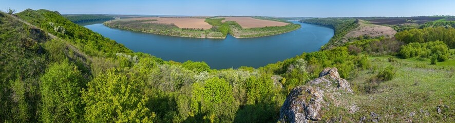 Amazing spring view on the Dnister River Canyon with picturesque rocks, fields, flowers. This place named Shyshkovi Gorby,  Nahoriany, Chernivtsi region, Ukraine.