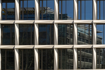 Closeup shot of square windows on a glass office building