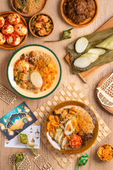Lontong sayur or vegetable rice cake is an Indonesian traditional rice dish made of pieces of lontong served in coconut milk soup with shredded chayote, tempeh, tofu, hard-boiled egg, sambal, rendang