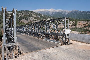 Aradena bridge is a wooden-planked bridge over the Gorge of Aradena at the height of 138m. White Mountains on the background. Sfakia district, Region of Chania, Crete,  Greece
