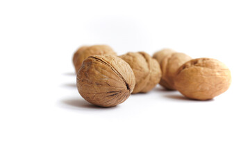Ripe walnuts on a white background.