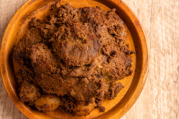 Beef Rendang is a Minang dish originating from the Minangkabau region in West Sumatra, Indonesia.  Rendang has been slow cooked and braised in a coconut milk seasoned with a herb and spice mixture