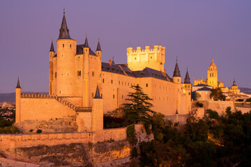 Fototapeta na wymiar View of the Alcazar fortress and St Mary cathedral of segovia illuminated at night, listed world Heritage centre by UNESCO