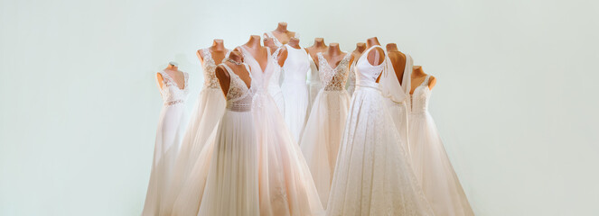 various beautiful wedding dresses as a background