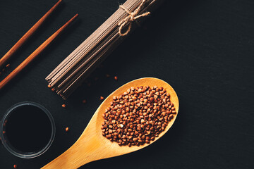 Fototapeta na wymiar Traditional Japanese buckwheat noodles soba, soy sauce, chopsticks and buckwheat.