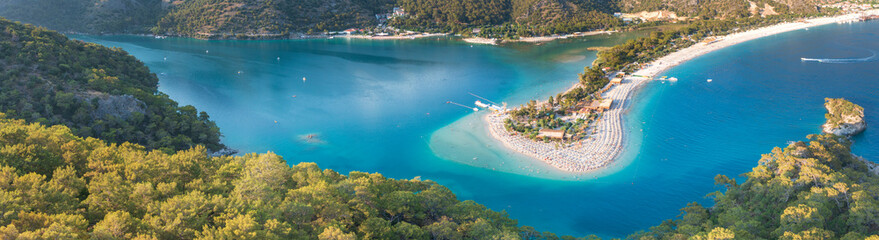 panoramic view of bay with emerald water and beach on sandbar in city Oludeniz in Turkey