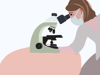 A medical worker looks through a microscope.