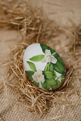 Easter painted egg in a nest of straw