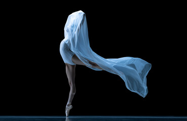 Graceful classic ballerina dancing with weightless fabric isolated on black studio background in neon. Theater, art, beauty, grace, action and motion concept.