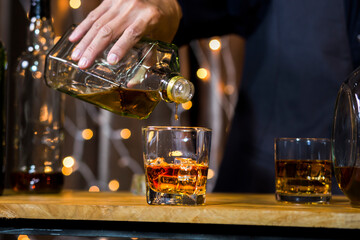 Bartender Serve Whiskey, on wood bar, 