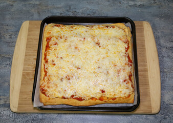 A homemade square croissant crust cheese pizza with marinara sauce.