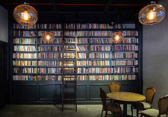 Wooden ladder standing on a bookshelf