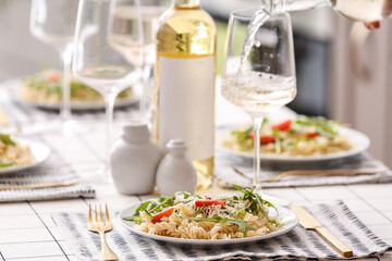 Plate of delicious pasta on table in restaurant