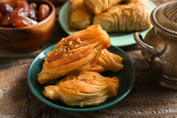 Tasty Turkish baklava on wooden background