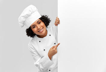 cooking, advertisement and people concept - happy smiling female chef in toque with white board over grey background - obrazy, fototapety, plakaty