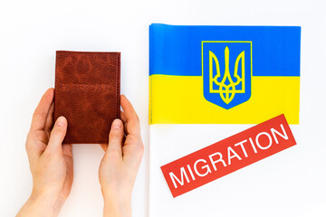 Ukrainian refugees migration concept. Ukaraine flag and passpotrs