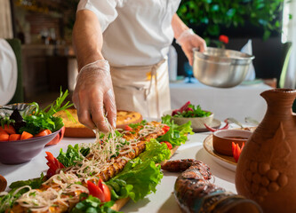 Georgian cuisine. A large laid table of different dishes for the whole family on a day off. Kebab, Lula, Lavash, Suluguni cheese, Khachipuri, Khinkali. background image
