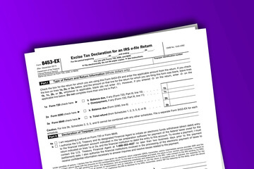 Obraz premium Form 8453-EX documentation published IRS USA 07.17.2012. American tax document on colored