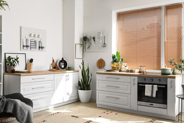 Interior of stylish kitchen with modern counters