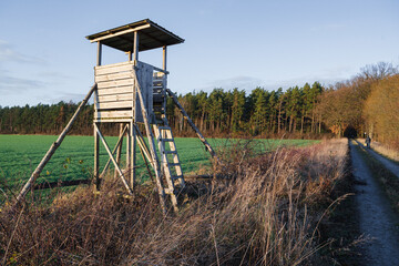 Closeup of a wooden watchtower in the farm field