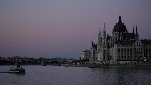 cathedral in hungary in budapest taken by the river with ships