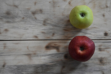 Top view of fresh red and green apples on a wooden surface - copy space - Powered by Adobe