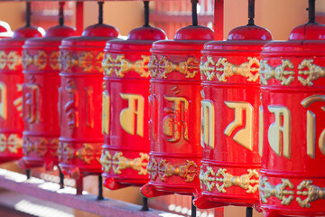 Prayer wheels at the yard of Datsan Gunzechoinei or Datsan Gunzechoyney. Buddhist prayer wheels...