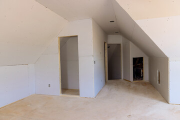 New construction of installing plasterboard in room new home drywall
